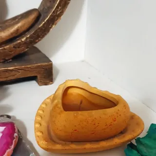 شمع در شعمدان گلی
